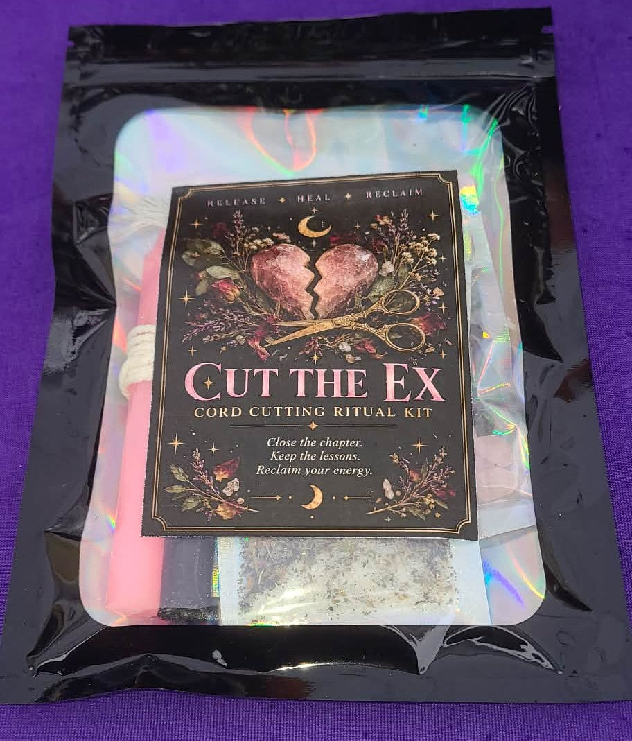 A packaged 'Cut the Ex' cord cutting ritual kit inside a black resealable pouch with an iridescent insert. The front card features a dark background with a broken heart, flowers, and the text 'Release • Heal • Reclaim' and 'Cut the Ex Cord Cutting Ritual Kit'.