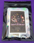 The Group Chat Breakup Cord Cutting Ritual Kit in a black resealable pouch with an iridescent holographic inner bag, shown on a purple background.