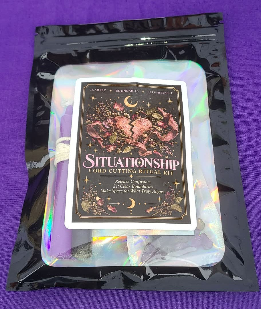 A 'Situationship Cord Cutting Ritual Kit' in an iridescent holographic pouch with a black outer sleeve, displayed on a purple textured background.